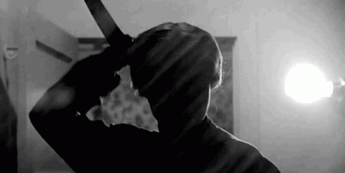 Person Holding Knife to Head
