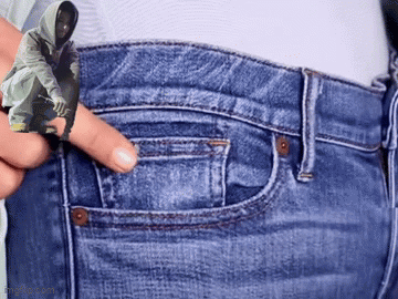 Person Holding Man In Hoodie Picture In Pocket GIF