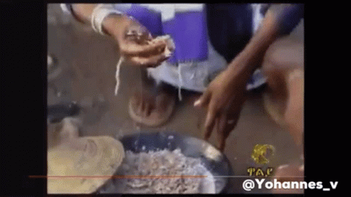 Person Holding Meat In Front Of Pan GIF