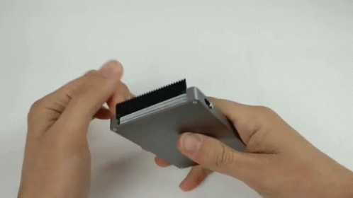 Person Holding Metal With Black Stripe GIF