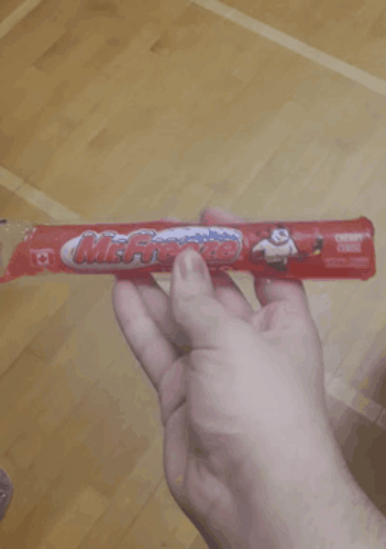 Person Holding Mr. Freeze Cereal Bar GIF