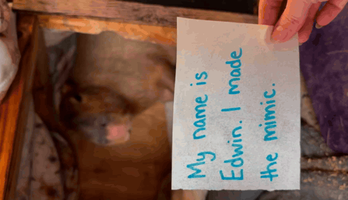 Person Holding Paper Saying My Name Is Edwin I Made The Mimic GIF