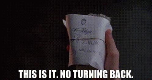 Person Holding Paper Saying This Is It No Turning Back