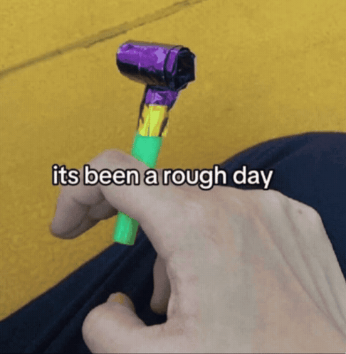 Person Holding Party Horn Saying Its Been a Rough Day