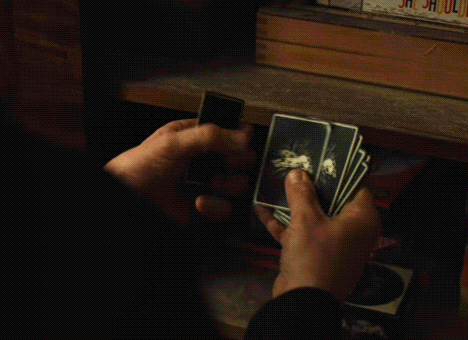 Person Holding Playing Cards