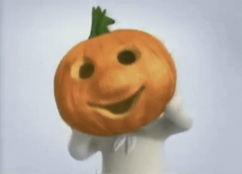 Person Holding Pumpkin and Smiling