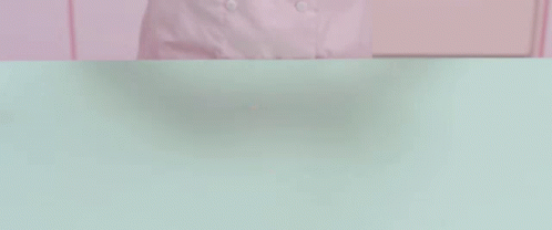 Person Holding Purple Chain Over Dough