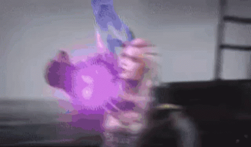 Person Holding Purple Object GIF