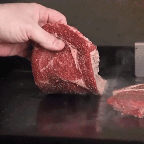 Person Holding Raw Meat