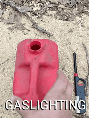 Person Holding Red Gas Can and Lighter Saying Gaslighting