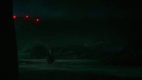 Person Holding Red Lightsaber GIF