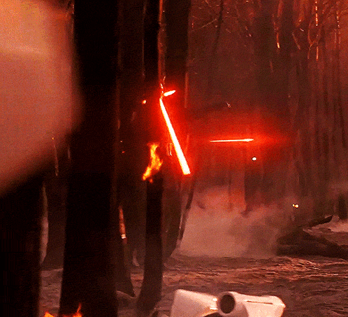 Person Holding Red Lightsaber GIF