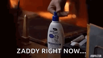 Person Holding Shaving Cream Bottle