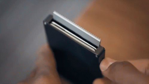 Person Holding Shaving Razor