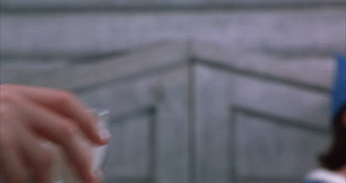 Person Holding Shot Glass With Foam GIF