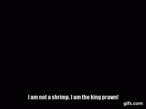 Person Holding Shrimp In Front Of Pepe Sign GIF