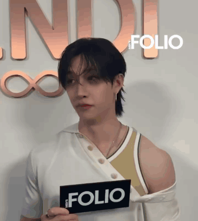 Person Holding Sign Saying Folio