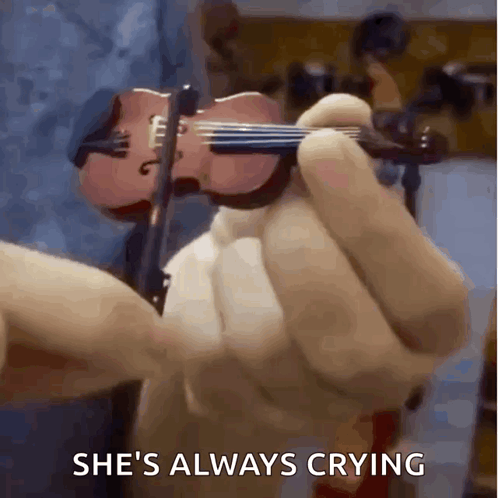 Person Holding Small Violin She's Always Crying