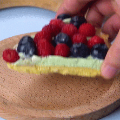 Person Holding Strawberry Cake