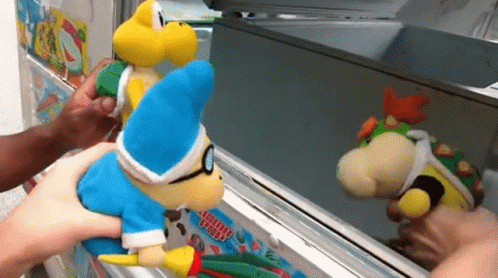 Person Holding Stuffed Animal at Ice Cream Head Machine