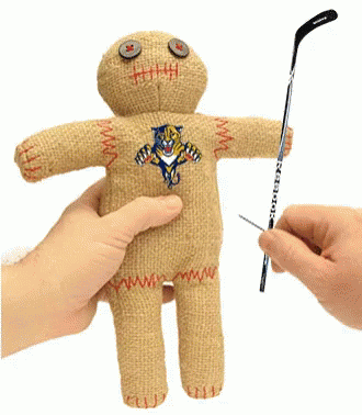 Person Holding Stuffed Doll and Hockey Stick