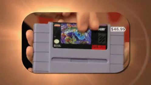 Person Holding Super Nintendo Game for $49.99