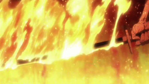Person Holding Sword by Flaming Wall