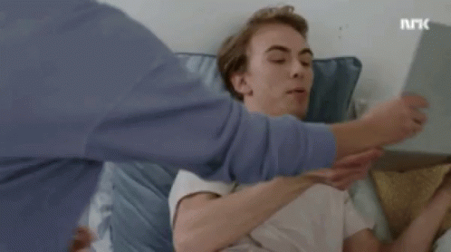 Person Holding Tablet In Front Of Face And Laptop GIF