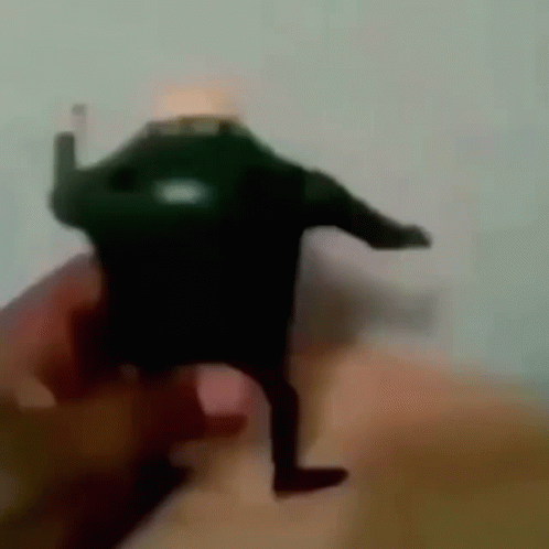 Person Holding Toy Figure