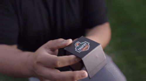 Person Holding Trophy Box