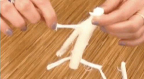 Person Holding White Yarn on Table