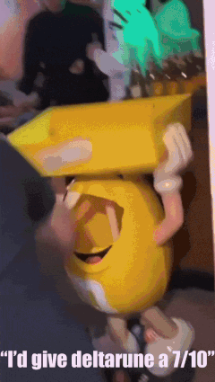 Person Holding Yellow Smiley Face Saying I'd Give Deltarune A 7/10 GIF