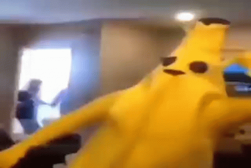 Person in Banana Costume Dancing with Woman