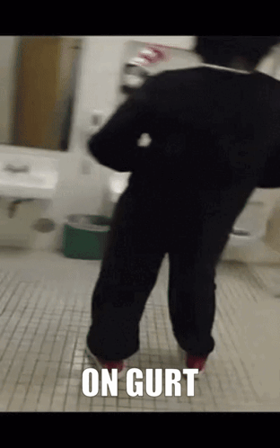 Person in Bathroom With On Gurt on Floor