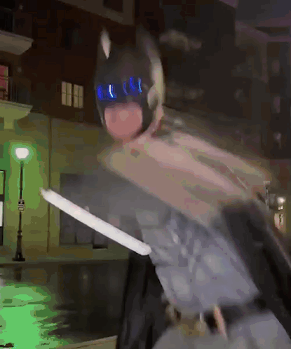 Person In Batman Costume Holding Sword GIF