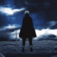 Person in Black Cape Holding Sword