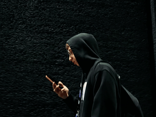 Person in Black Hoodie Talking on Phone