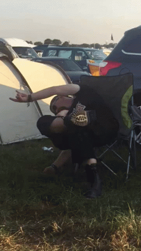 Person in Black Leaf Shirt on Folding Chair