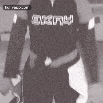 Person In Black Shirt With DKNY GIF