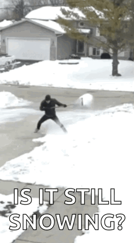 Person in Blue Coat Walking Through Snow