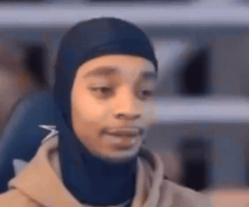 Person in Blue Hooded Hat Close Up