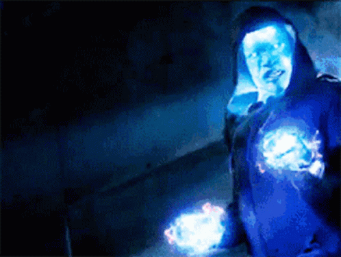 Person In Blue Hoodie Surrounded By Glowing Lights GIF