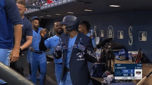 Person in Blue Jays Shirt in Dugout