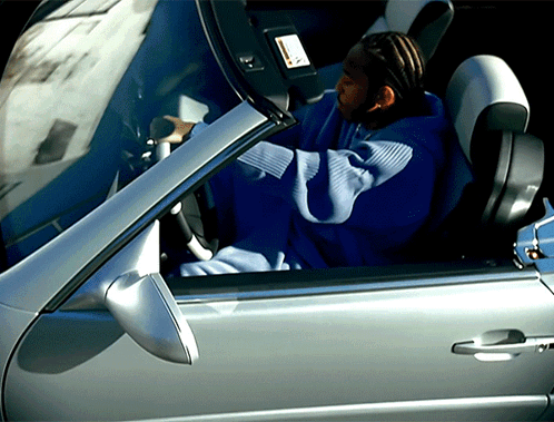 Person in Blue Sweatshirt With Letter U