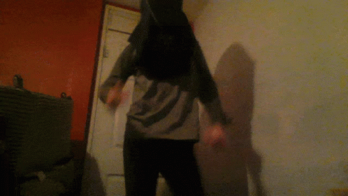 Person in Bunny Costume Standing in Dark Room