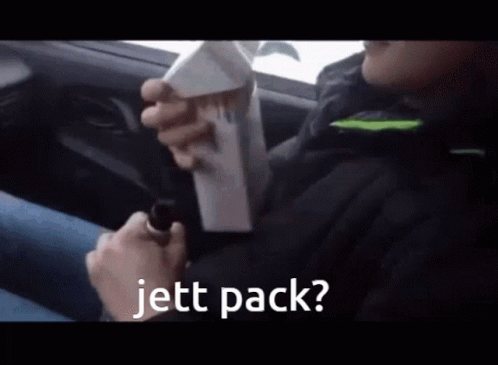 Person in Car Holding Box Saying Jett Pack