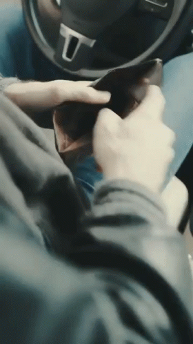 Person In Car With Steering Wheel Letter U GIF