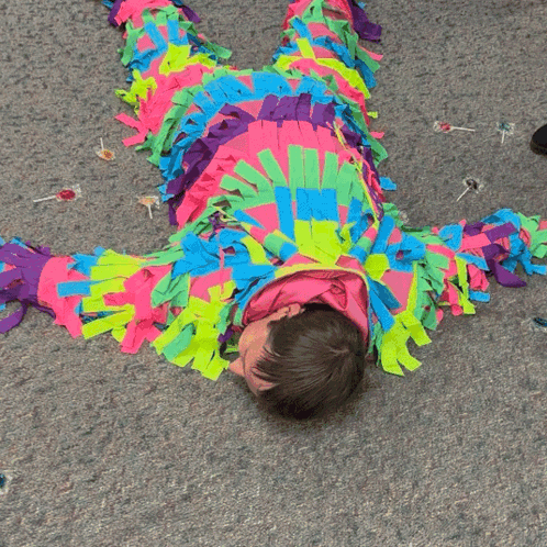 Person In Colorful Costume Lying On Back GIF