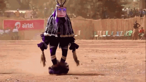 Person In Costume In Front Of Airtel Sign GIF