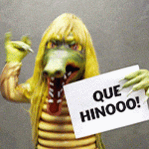 Person in Crocodile Costume Holding Sign Que Hinooo